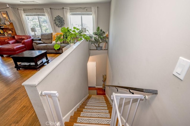 1134 N Rowan Ave, East Los Angeles, CA 90063 - stairs featuring wood finished floors and baseboards