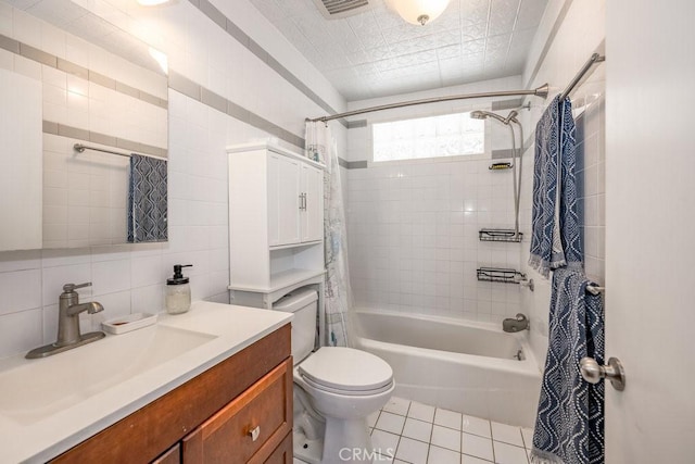 1134 N Rowan Ave, East Los Angeles, CA 90063 - full bath with shower / bath combo with shower curtain, vanity, tile patterned flooring, tile walls, and decorative backsplash