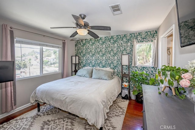 1134 N Rowan Ave, East Los Angeles, CA 90063 - bedroom with wood finished floors, a ceiling fan, and wallpapered walls