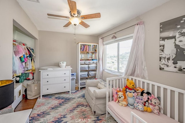 1134 N Rowan Ave, East Los Angeles, CA 90063 - bedroom with a ceiling fan, wood finished floors, and a closet