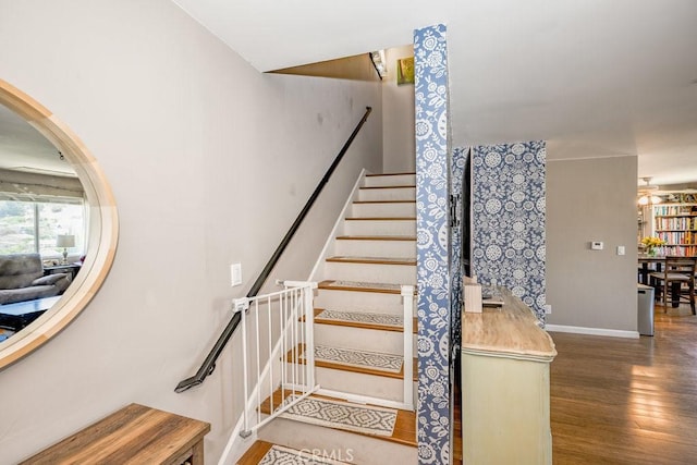 1134 N Rowan Ave, East Los Angeles, CA 90063 - stairs featuring wood finished floors and baseboards