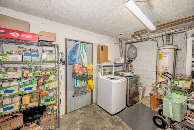 1134 N Rowan Ave, East Los Angeles, CA 90063 - laundry room featuring washing machine and dryer, water heater, a textured ceiling, and concrete block wall