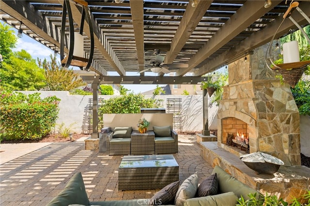46287 Durango Dr, Temecula, CA 92592 - fenced backyard featuring an outdoor living space with a fireplace, ceiling fan, a patio area, and a pergola