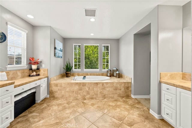 46287 Durango Dr, Temecula, CA 92592 - full bath with healthy amount of natural light, a garden tub, vanity, and recessed lighting