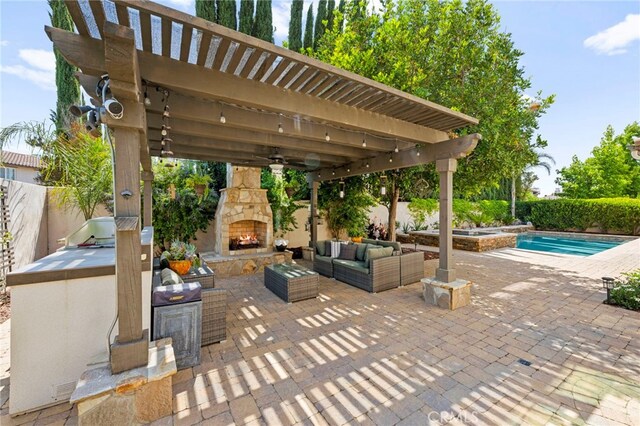 46287 Durango Dr, Temecula, CA 92592 - fenced backyard featuring a patio area, an outdoor living space with a fireplace, a pool with connected hot tub, and a ceiling fan