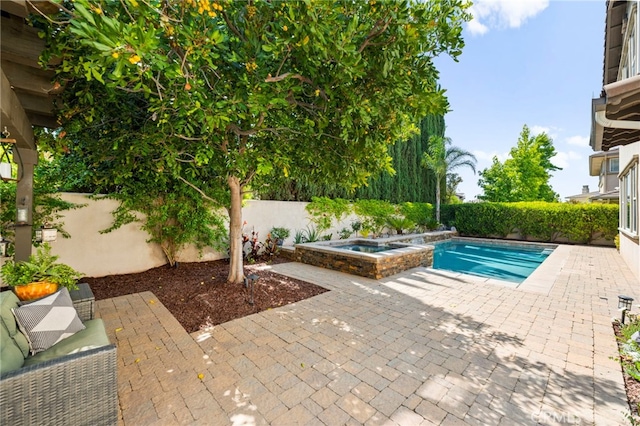 46287 Durango Dr, Temecula, CA 92592 - view of pool with a patio, a fenced backyard, and a pool with connected hot tub