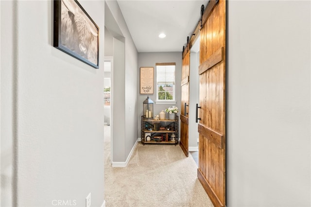 46287 Durango Dr, Temecula, CA 92592 - corridor featuring a barn door, light carpet, and recessed lighting