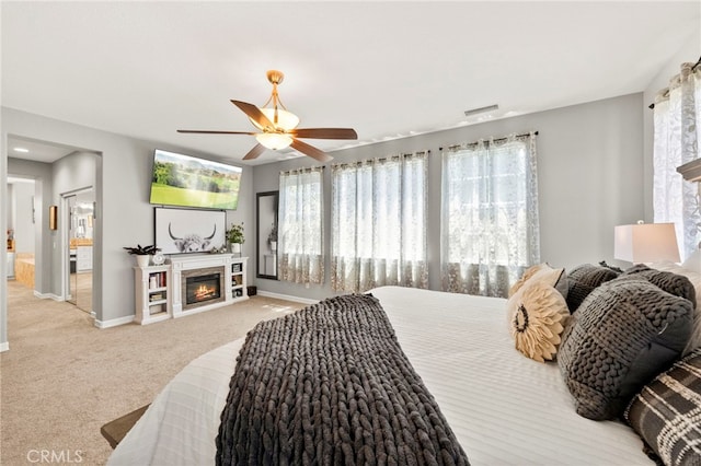 46287 Durango Dr, Temecula, CA 92592 - bedroom featuring a glass covered fireplace, carpet, and a ceiling fan