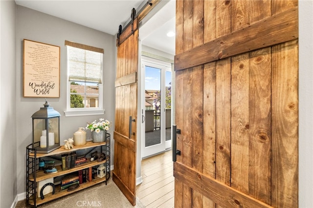 46287 Durango Dr, Temecula, CA 92592 - entryway with healthy amount of natural light and a barn door