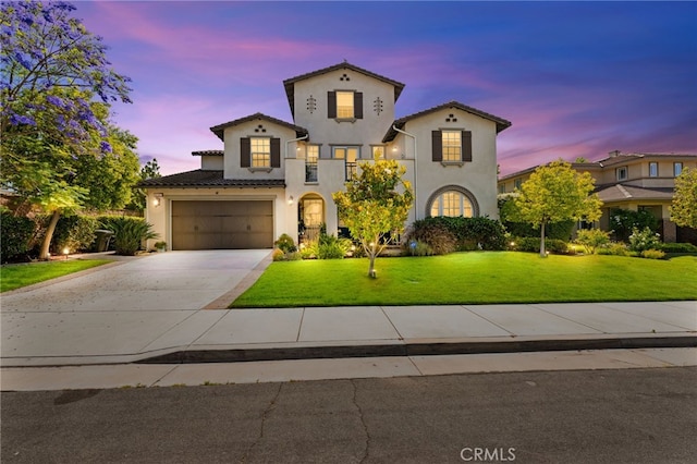46287 Durango Dr, Temecula, CA 92592 - mediterranean / spanish home with stucco siding, driveway, a yard, and a garage