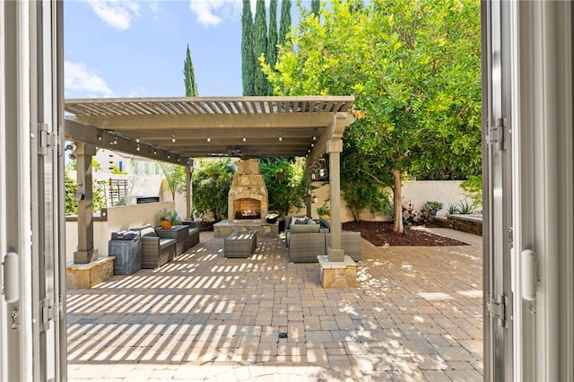 46287 Durango Dr, Temecula, CA 92592 - view of patio / terrace featuring an outdoor living space with a fireplace and a pergola