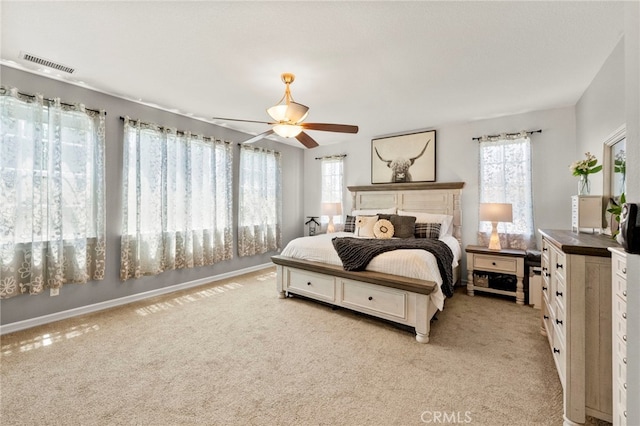 46287 Durango Dr, Temecula, CA 92592 - bedroom featuring multiple windows, light colored carpet, and a ceiling fan