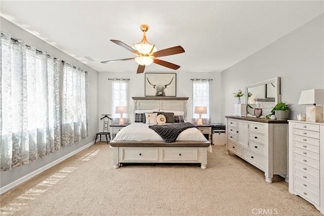 46287 Durango Dr, Temecula, CA 92592 - bedroom with light colored carpet, multiple windows, and a ceiling fan