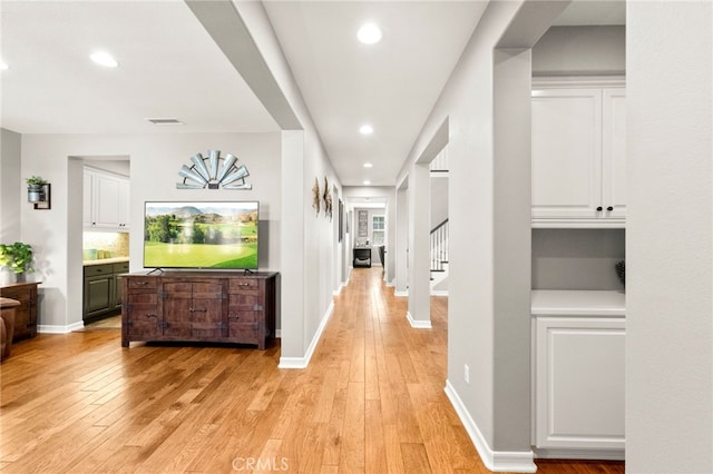 46287 Durango Dr, Temecula, CA 92592 - hall with light wood-style flooring, recessed lighting, and stairs