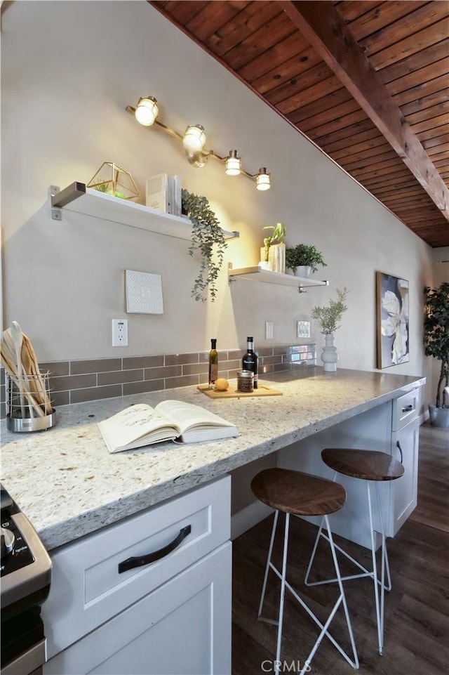 4917 W 140th St, Hawthorne, CA 90250 - kitchen featuring wooden ceiling, tasteful backsplash, white cabinets, dark wood-style flooring, and light stone counters