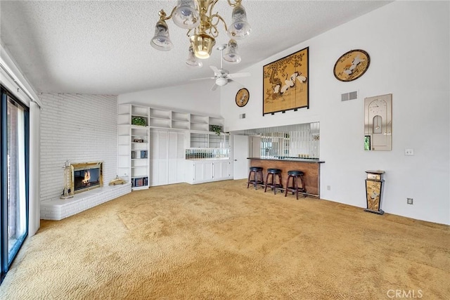2591 Braided Mane Dr, Diamond Bar, CA 91765 - carpeted living area featuring a textured ceiling, ceiling fan, a fireplace, a chandelier, and high vaulted ceiling