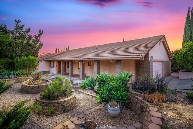 2591 Braided Mane Dr, Diamond Bar, CA 91765 - single story home featuring a garage, a tile roof, a porch, stucco siding, and brick siding