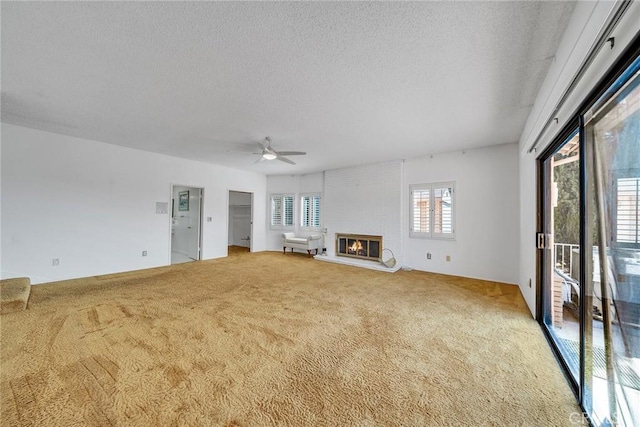 2591 Braided Mane Dr, Diamond Bar, CA 91765 - unfurnished living room featuring a textured ceiling, light colored carpet, a ceiling fan, and a fireplace