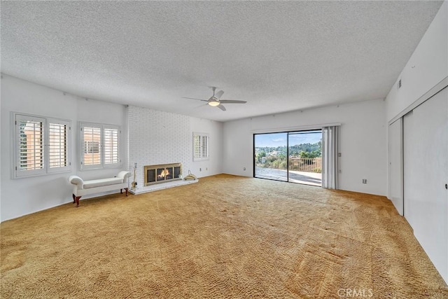2591 Braided Mane Dr, Diamond Bar, CA 91765 - unfurnished living room featuring a ceiling fan, carpet, a textured ceiling, and a fireplace