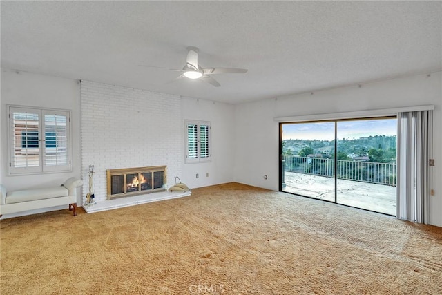 2591 Braided Mane Dr, Diamond Bar, CA 91765 - unfurnished living room featuring a ceiling fan, carpet flooring, a textured ceiling, and a brick fireplace