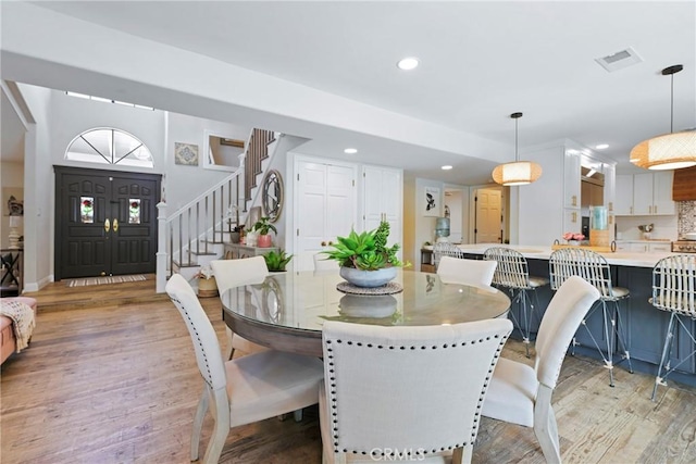 3380 E Date St, Brea, CA 92823 - dining room featuring light wood-type flooring, stairway, and recessed lighting