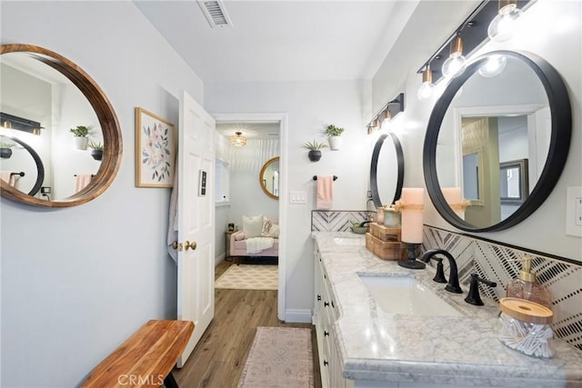 3380 E Date St, Brea, CA 92823 - bathroom with ensuite bath, wood finished floors, and double vanity