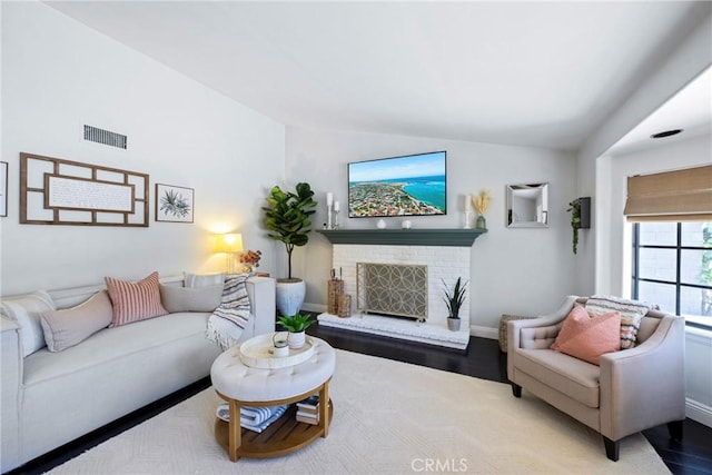3380 E Date St, Brea, CA 92823 - living room with lofted ceiling, a brick fireplace, and wood finished floors