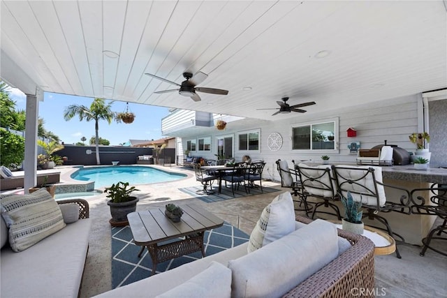 3380 E Date St, Brea, CA 92823 - view of swimming pool with an outdoor living space, exterior bar, a patio, and a fenced backyard