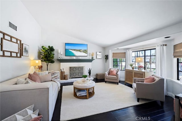3380 E Date St, Brea, CA 92823 - living area featuring wood finished floors, a brick fireplace, and lofted ceiling