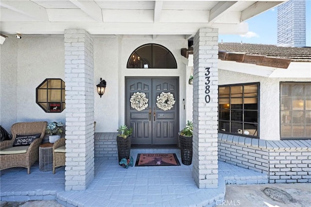 3380 E Date St, Brea, CA 92823 - property entrance featuring stucco siding and a security system