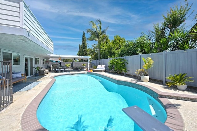 3380 E Date St, Brea, CA 92823 - view of swimming pool featuring a fenced backyard, a patio area, and a diving board