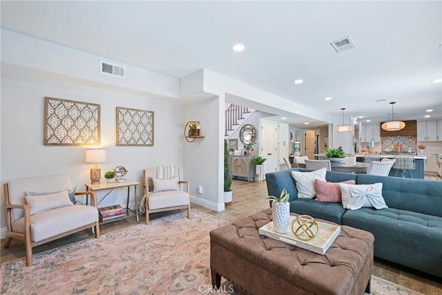 3380 E Date St, Brea, CA 92823 - living room with recessed lighting, light wood finished floors, and stairway