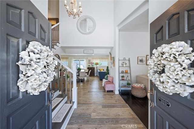 3380 E Date St, Brea, CA 92823 - foyer entrance featuring stairs, a chandelier, a towering ceiling, and dark wood-style flooring