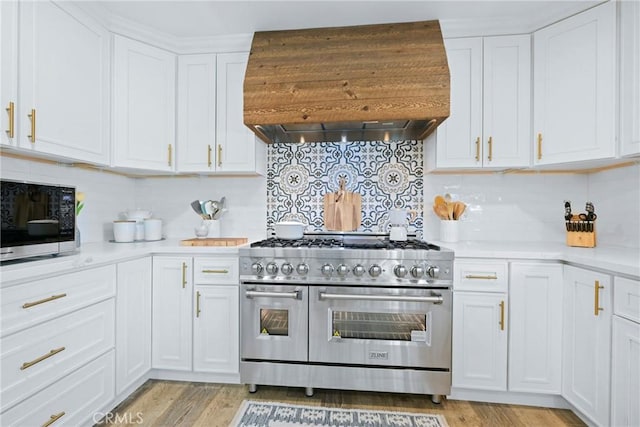 3380 E Date St, Brea, CA 92823 - kitchen featuring custom range hood, range with two ovens, light countertops, and decorative backsplash