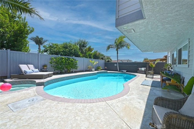 3380 E Date St, Brea, CA 92823 - view of swimming pool with a jacuzzi, a fenced backyard, and a patio area