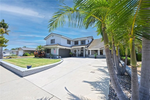 3380 E Date St, Brea, CA 92823 - traditional-style house featuring a garage, driveway, stucco siding, and a front yard