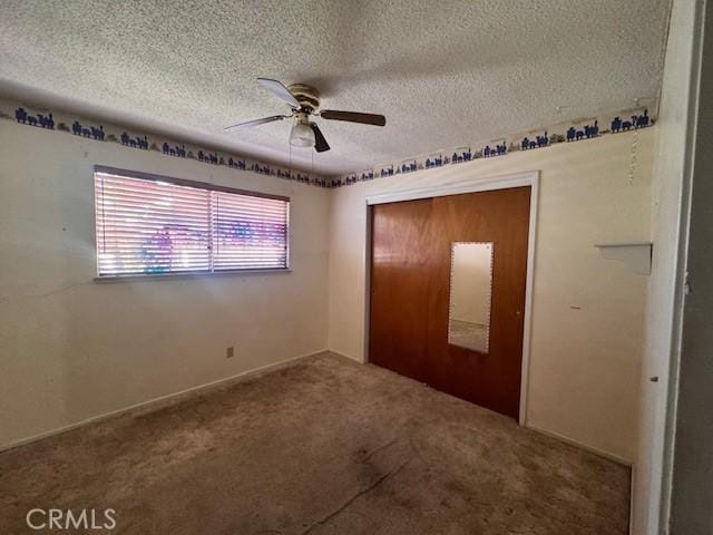 3246 Shamrock Ave, Merced, CA 95340 - unfurnished bedroom featuring carpet flooring, a textured ceiling, a closet, and a ceiling fan