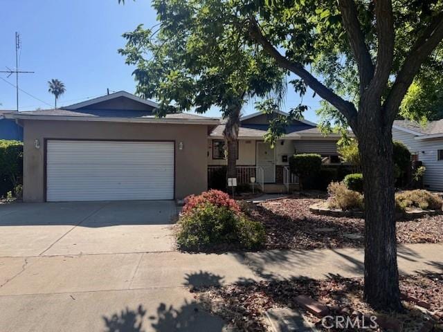 3246 Shamrock Ave, Merced, CA 95340 - single story home with stucco siding, a garage, and driveway