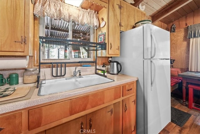 33019 Juniper Ln, Green Valley Lake, CA 92341 - kitchen featuring freestanding refrigerator, light countertops, wood finished floors, a wood ceiling with exposed beams, and brown cabinetry