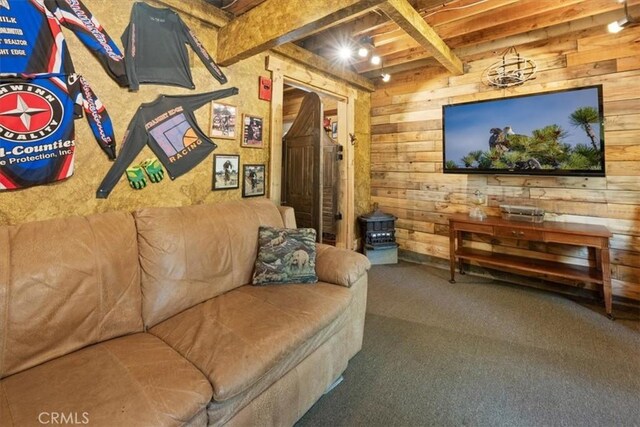33019 Juniper Ln, Green Valley Lake, CA 92341 - living room featuring beamed ceiling, wood walls, and carpet floors