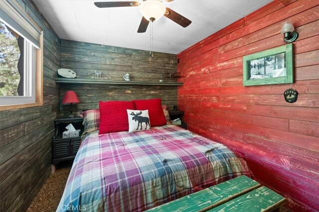 33019 Juniper Ln, Green Valley Lake, CA 92341 - carpeted bedroom with wood walls and a ceiling fan