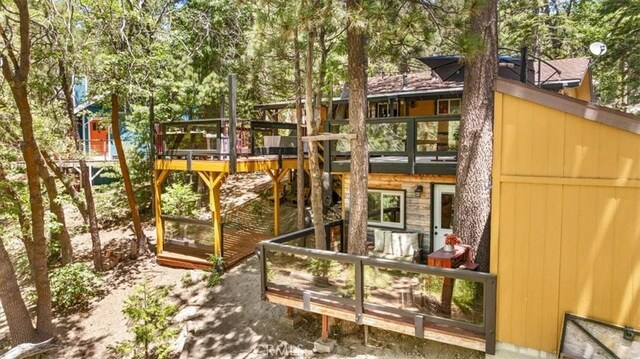 33019 Juniper Ln, Green Valley Lake, CA 92341 - rear view of property featuring view of wooded area and a deck with water view