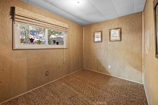 33019 Juniper Ln, Green Valley Lake, CA 92341 - empty room with carpet flooring and wooden walls