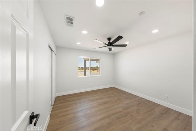 58424 Canterbury St, Yucca Valley, CA 92284 - unfurnished bedroom with recessed lighting, light wood-style floors, ceiling fan, and a closet