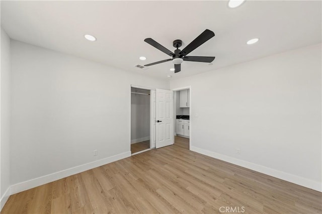 58424 Canterbury St, Yucca Valley, CA 92284 - unfurnished bedroom featuring light wood-style floors, a closet, recessed lighting, and ceiling fan