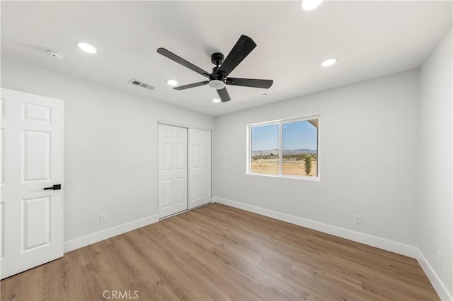 58424 Canterbury St, Yucca Valley, CA 92284 - unfurnished bedroom featuring light wood-type flooring, recessed lighting, a closet, and ceiling fan