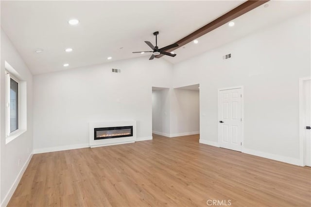 58424 Canterbury St, Yucca Valley, CA 92284 - unfurnished living room with a ceiling fan, light wood-style flooring, a glass covered fireplace, recessed lighting, and high vaulted ceiling