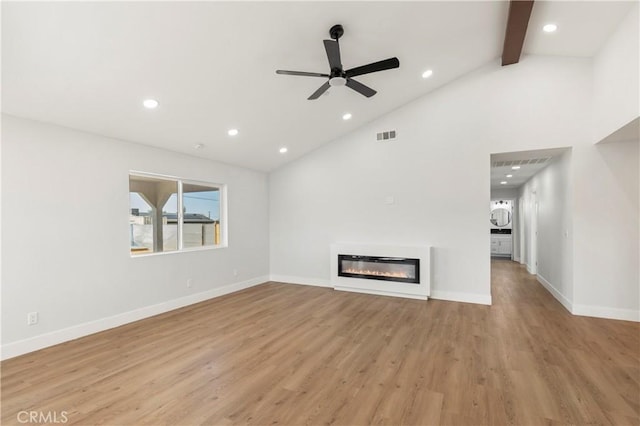 58424 Canterbury St, Yucca Valley, CA 92284 - unfurnished living room featuring recessed lighting, light wood-type flooring, beam ceiling, a glass covered fireplace, and ceiling fan