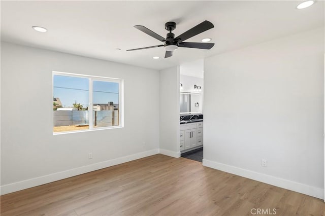 58424 Canterbury St, Yucca Valley, CA 92284 - empty room with ceiling fan, recessed lighting, and light wood-style floors