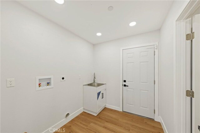 58424 Canterbury St, Yucca Valley, CA 92284 - laundry room featuring electric dryer hookup, washer hookup, light wood-type flooring, and recessed lighting